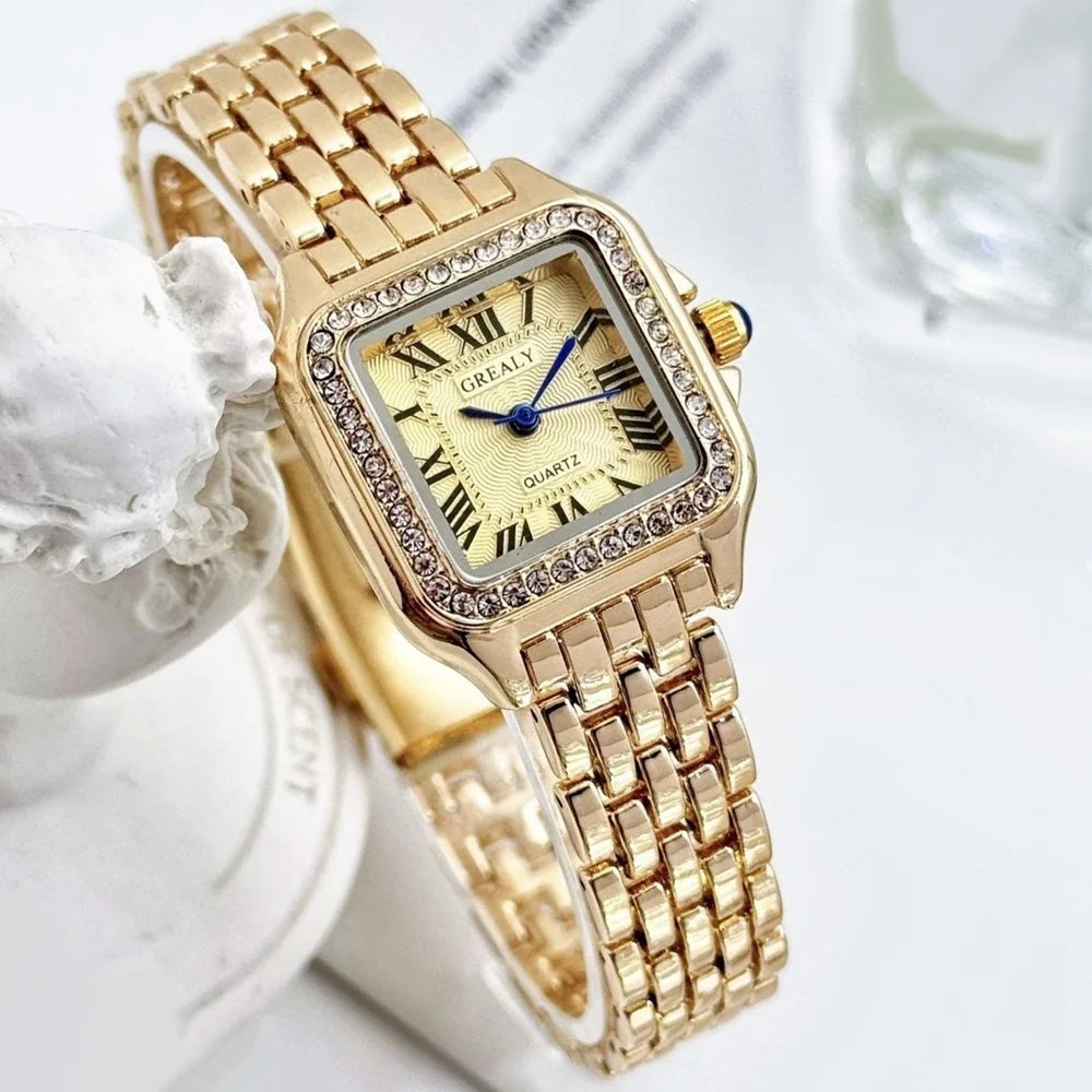 Gold wristwatch with decorative case on a gold background